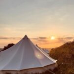 Bell tents at sunset on Eweleaze Farm
